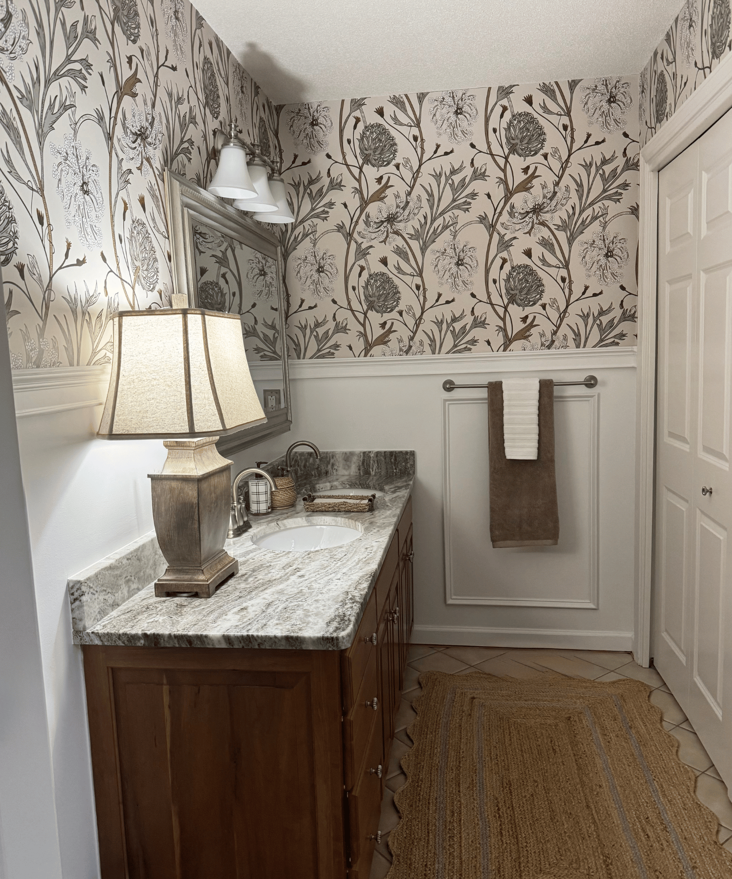 Bathroom featuring bold, playful wallpaper