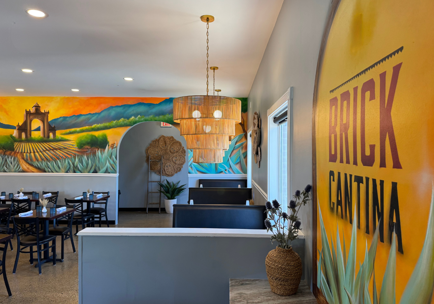 Vibrant dining room designed by HB Stevens featuring lively murals, bold artwork, and a customer-centered seating layout