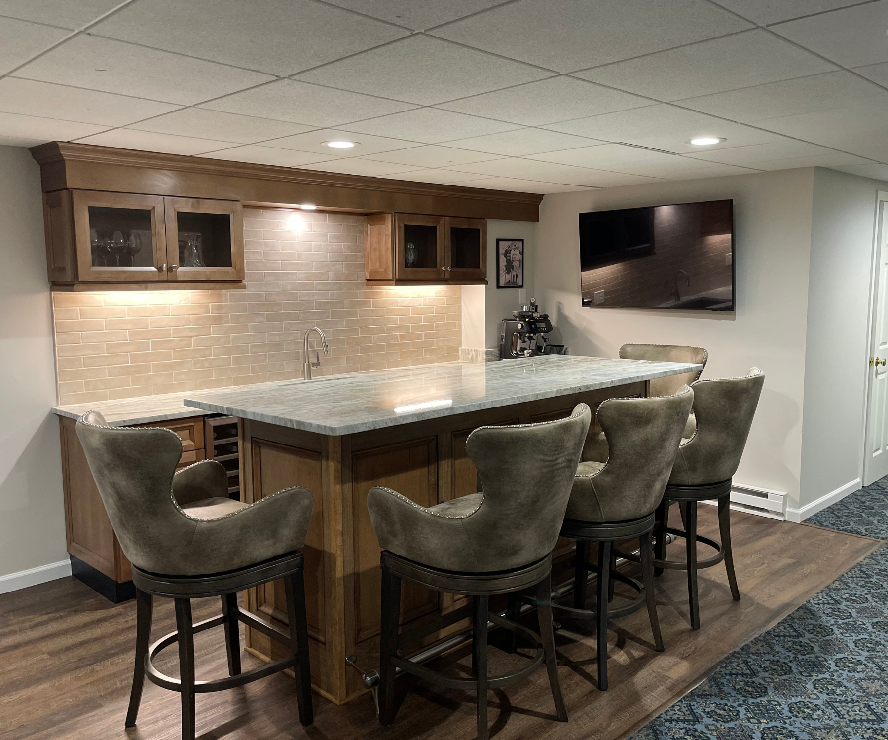 Luxury basement bar featuring a clean, polished aesthetic